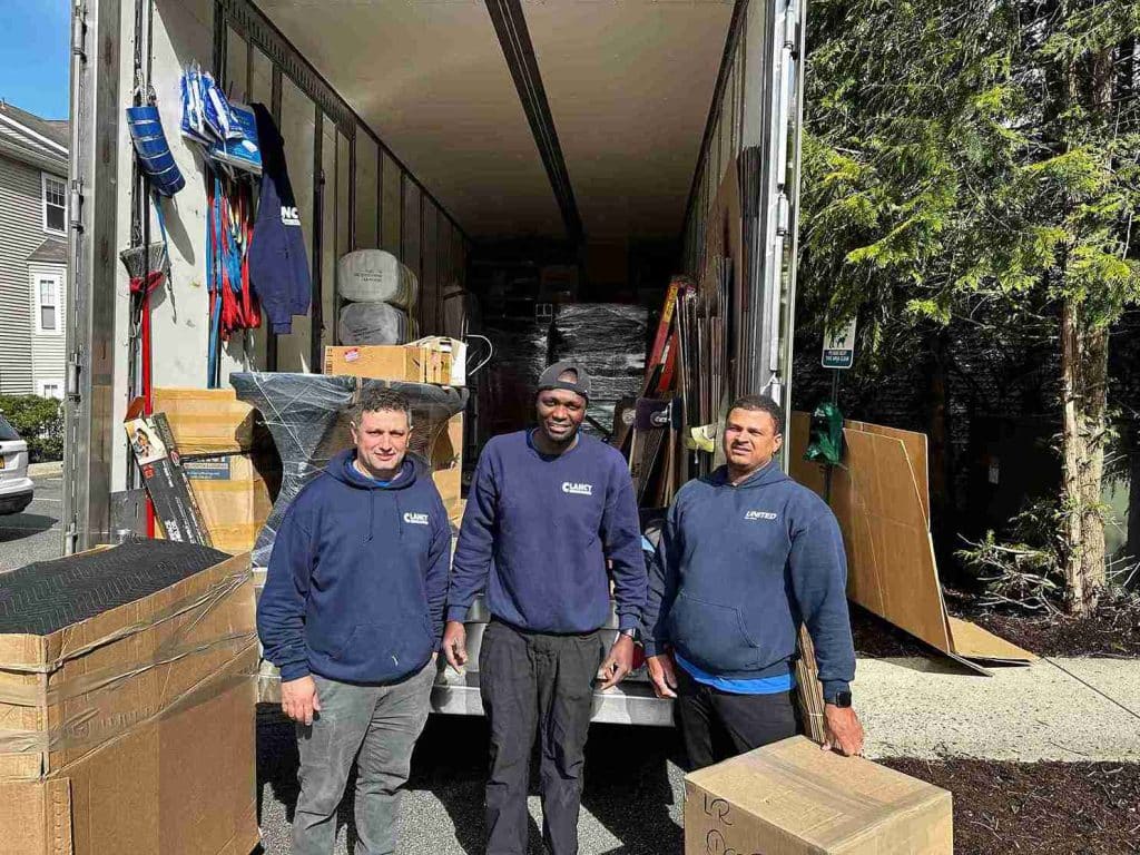 movers with packages and moving truck