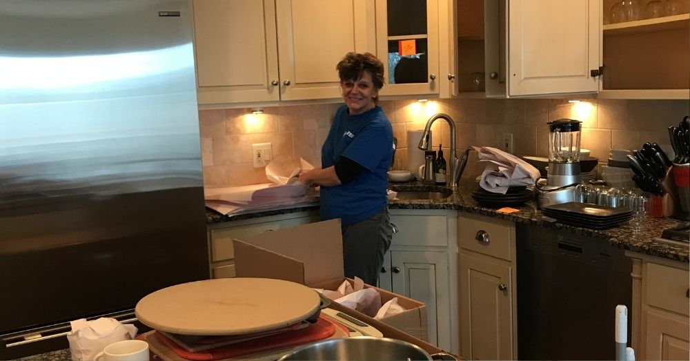 girl mover prepping packages