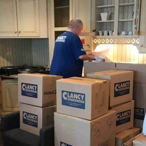 man carefully packing the items