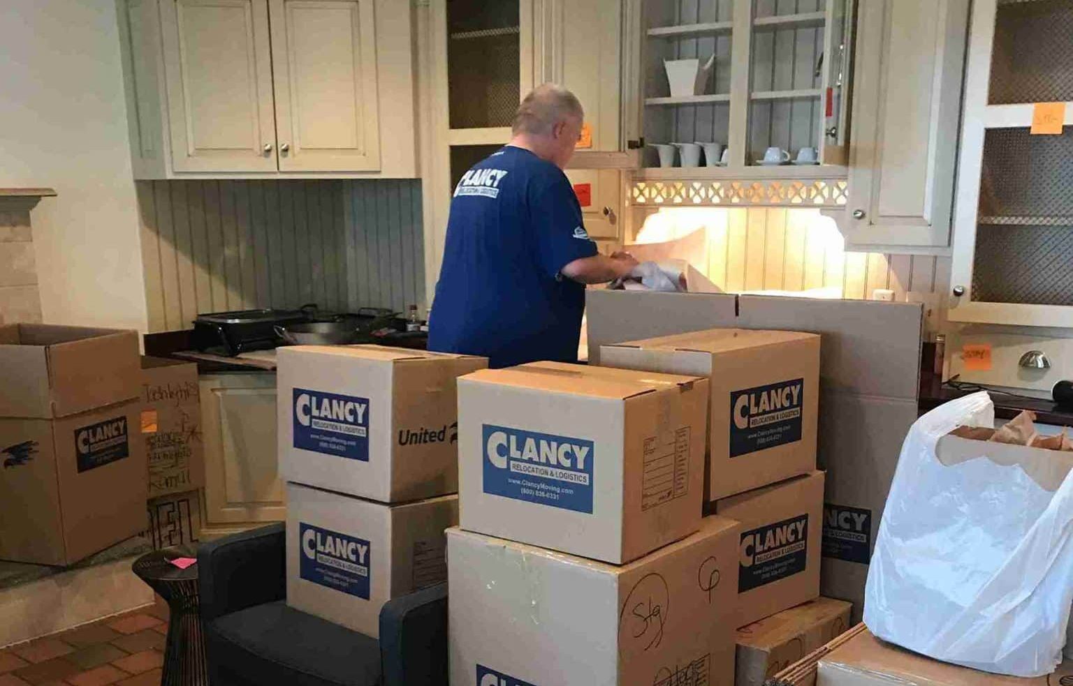 man carefully packing the items