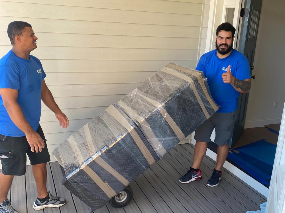 movers moving furniture out of the house