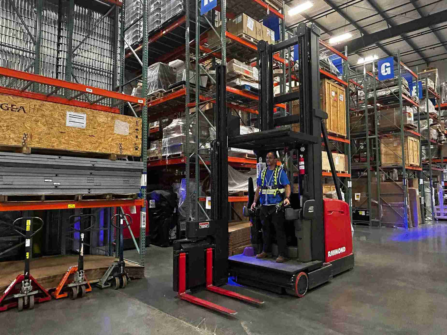 man riding in forklift