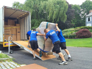 clancy mover pushing boxes to courier 