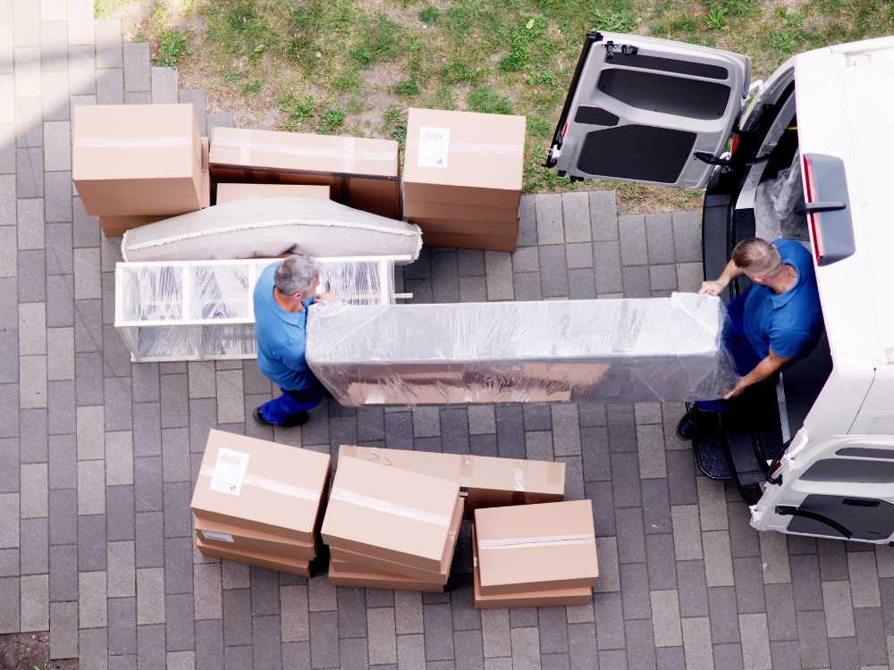 Loading boxes to moving courier